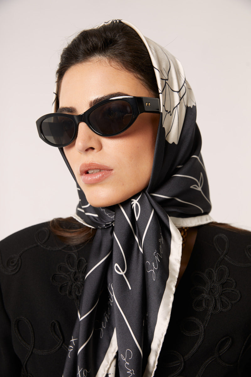 Black Señorita Luisa scarf, soft and stylish scarf with elegant drape, perfect for adding a sophisticated touch to any outfit.