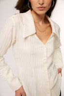 Ivory Alba blouse by Señorita displayed on a hanger, showcasing its elegant design and soft fabric for women’s shirts.