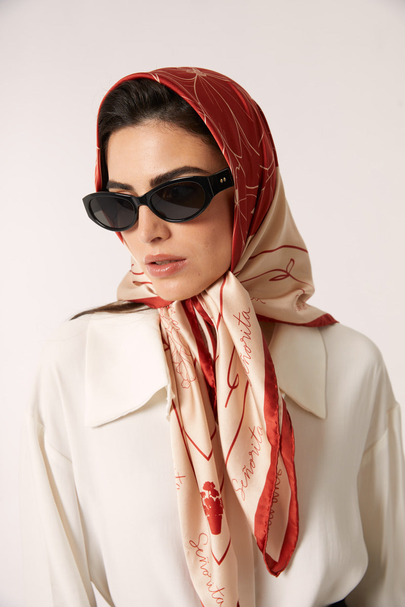 Red Señorita Luisa scarf featuring soft fabric and stylish design, perfect for adding a touch of elegance to any outfit.