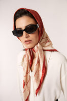 Red Señorita Luisa scarf featuring soft fabric and stylish design, perfect for adding a pop of color to any outfit.