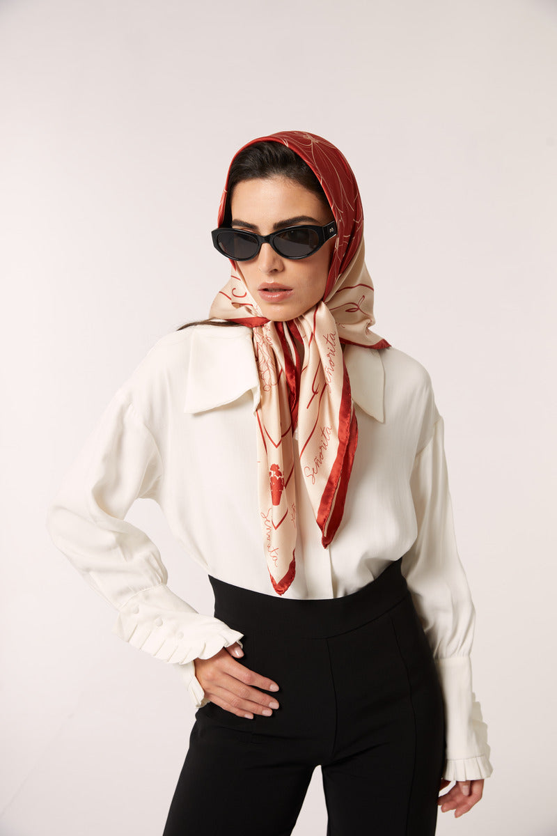 Red Señorita Luisa scarf made of soft fabric, featuring stylish design, perfect for adding a pop of color to your outfit.