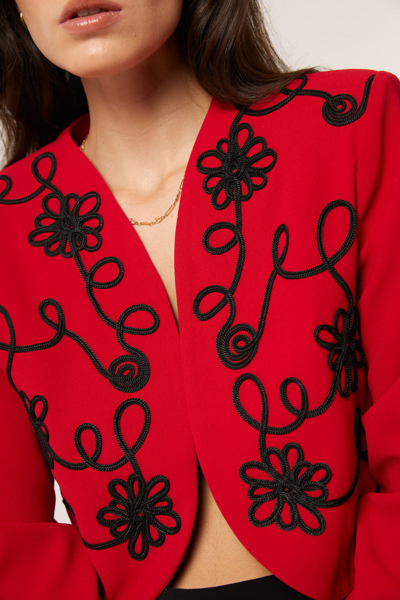 Red Señorita Rosalía jacket with a stylish, tailored fit, featuring a sleek collar and front zipper detail.