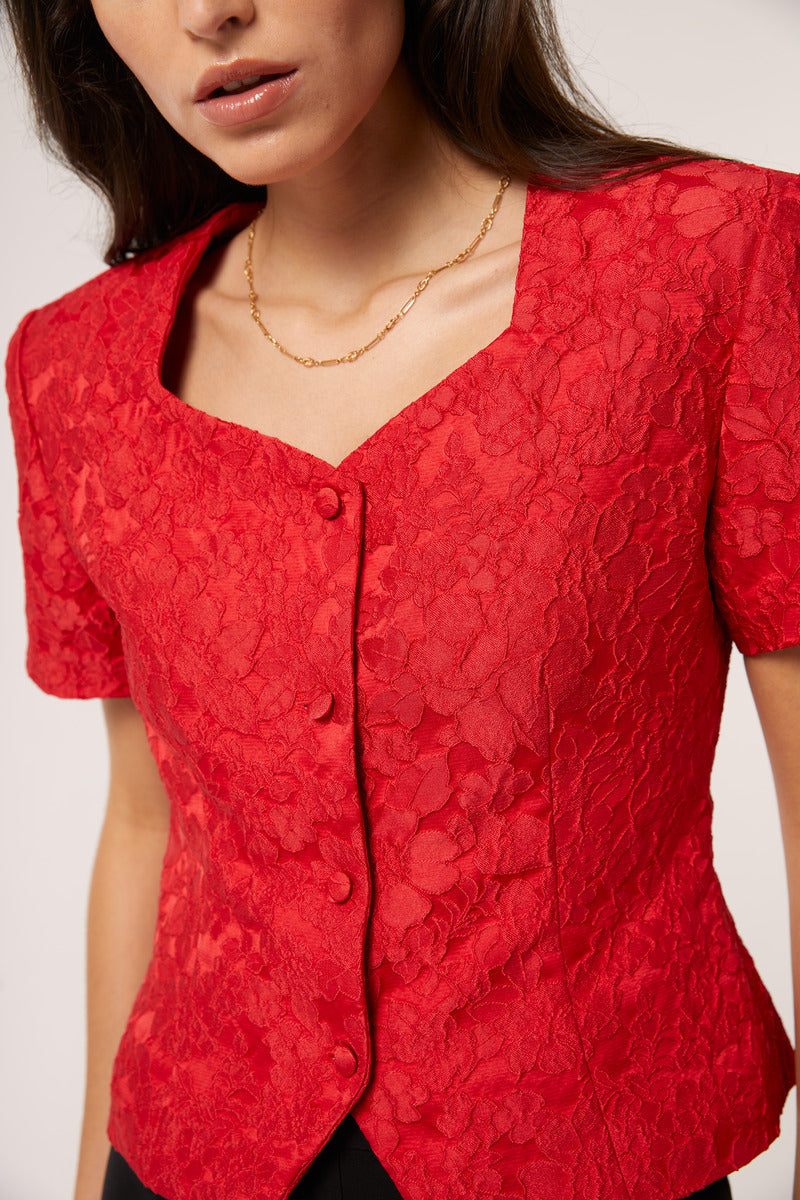 Red Señorita Aurora top, stylish women's blouse featuring a flattering fit, shown in the product image.
