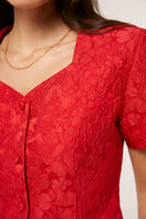 Red Señorita Aurora top, stylish women's blouse with long sleeves and a modern fit, perfect for casual or dressy occasions.