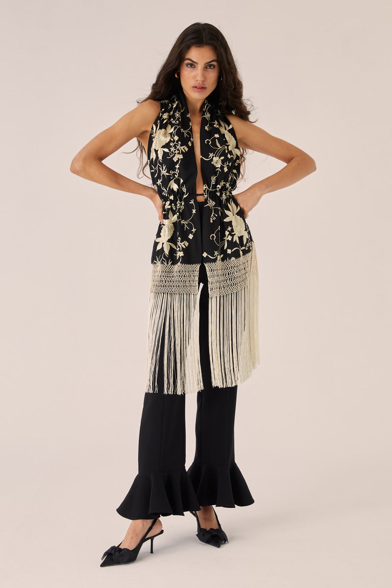 Black Señorita ROCIO top with stylish design, displayed on a model, showcasing the fashionable women's tops collection.