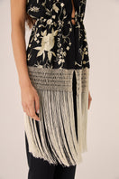 Black Señorita Rocio top, stylish women's fashion top with long sleeves and knot detail, shown on a model.
