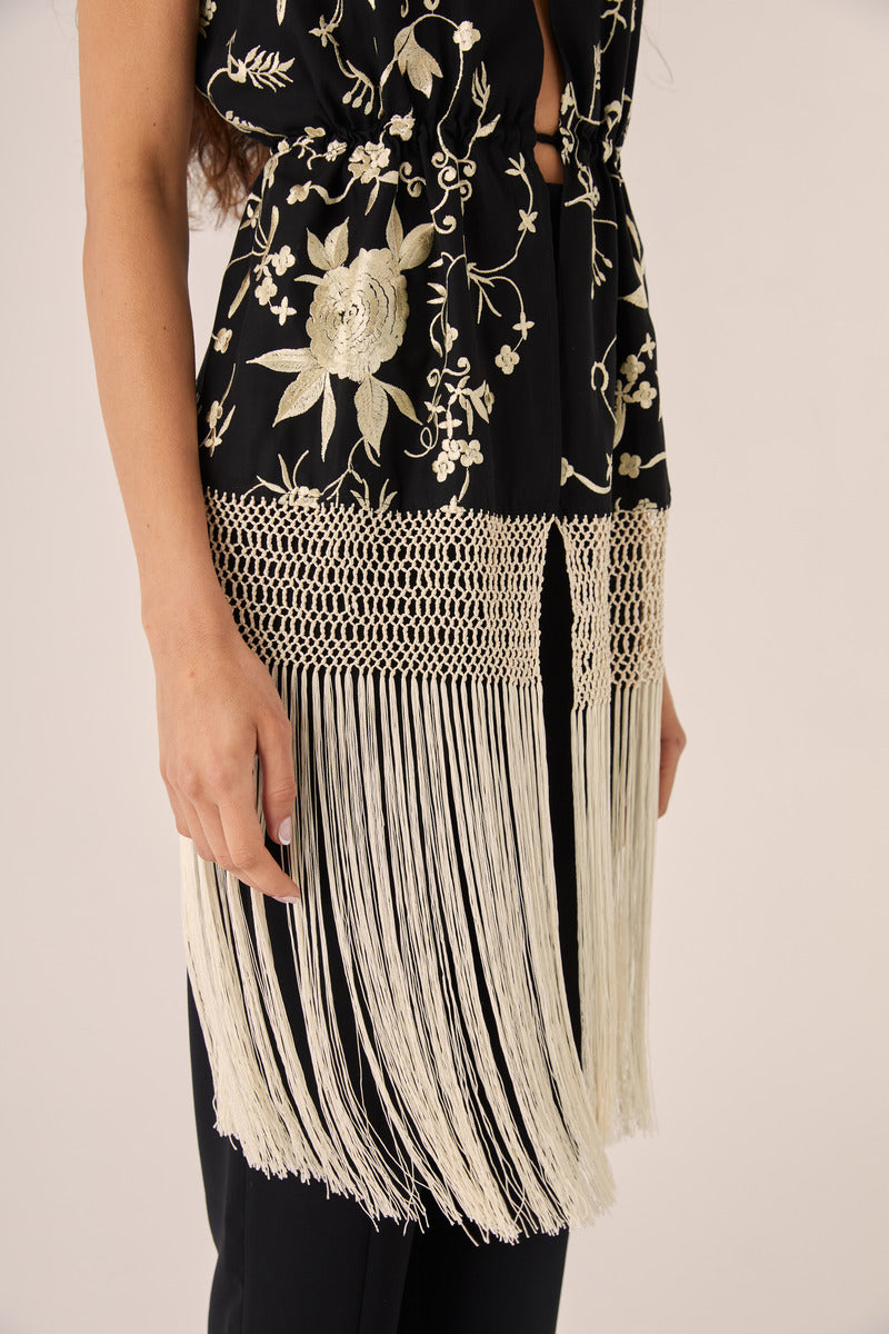 Black Señorita Rocio top, stylish women's fashion top with long sleeves and knot detail, shown on a model.
