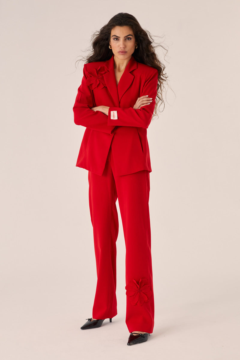 Red Señorita Teresa blazer with tailored fit and stylish lapels, displayed on a hanger.