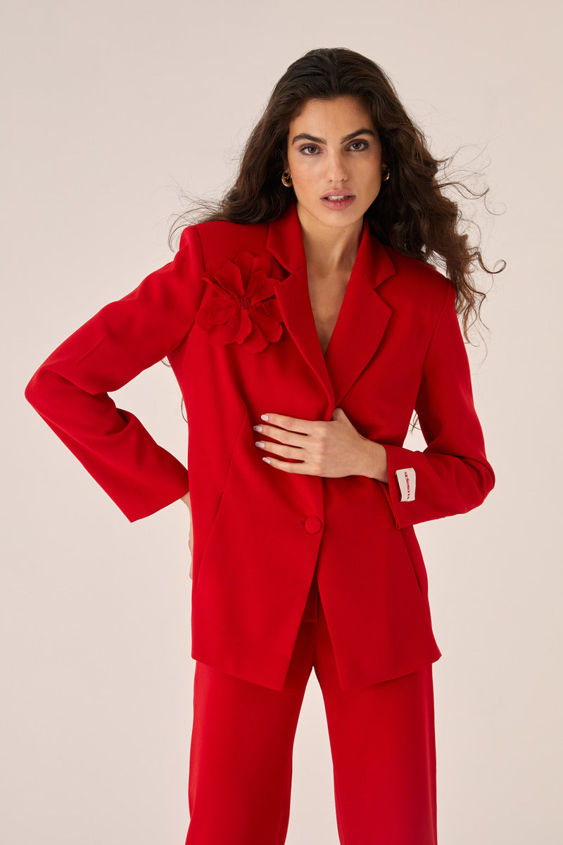 Red Señorita Teresa blazer shown on a model, featuring tailored fit and stylish lapel design.
