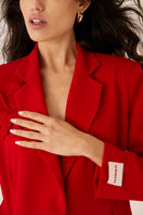 Red Señorita Teresa blazer jacket with tailored fit, featuring classic lapels and structured design, shown on a model.