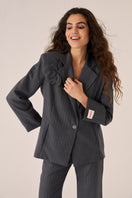 Gray Señorita Adriana Pants, slim-fit with side pockets, shown on a model against a neutral background.