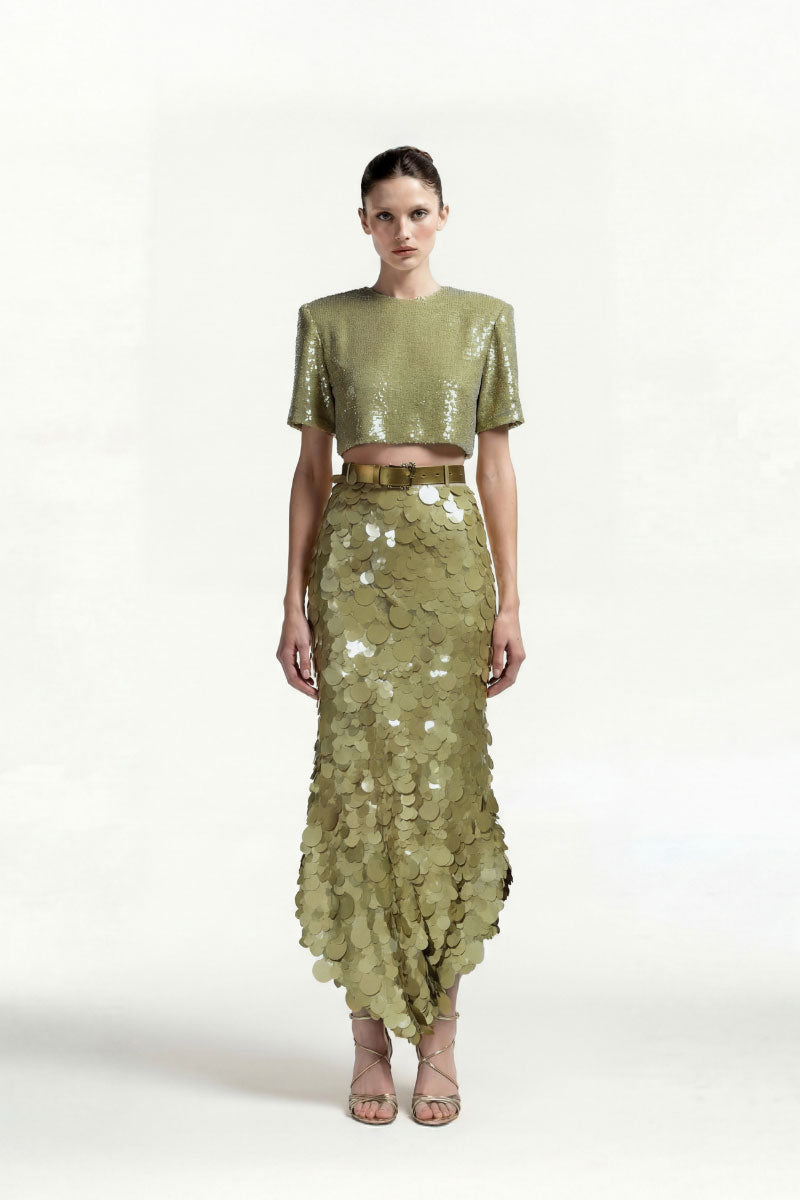 Green sequin back-slit top by Tayfun Kaba, stylish women's tops with shimmering sequins and a back slit design.