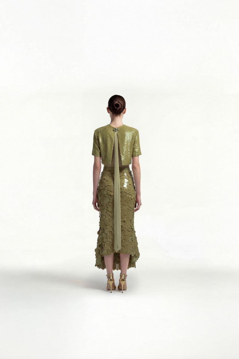 Green sequin midi skirt by Tayfun Kaba, featuring shiny sequins and flowy midi length fabric, ideal for stylish occasions.