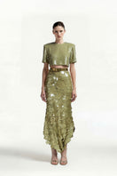 Green sequin midi skirt by Tayfun Kaba, showcasing shimmering fabric and elegant length, perfect for stylish casual or evening wear.