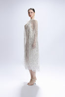 White Valenciani sequin midi cape dress gown featuring elegant draped design and intricate sequin embellishments.