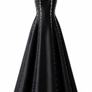 Black Seraphine gown by Nihan Peker, elegant long dress with flowing fabric and subtle detailing, suitable for formal occasions.