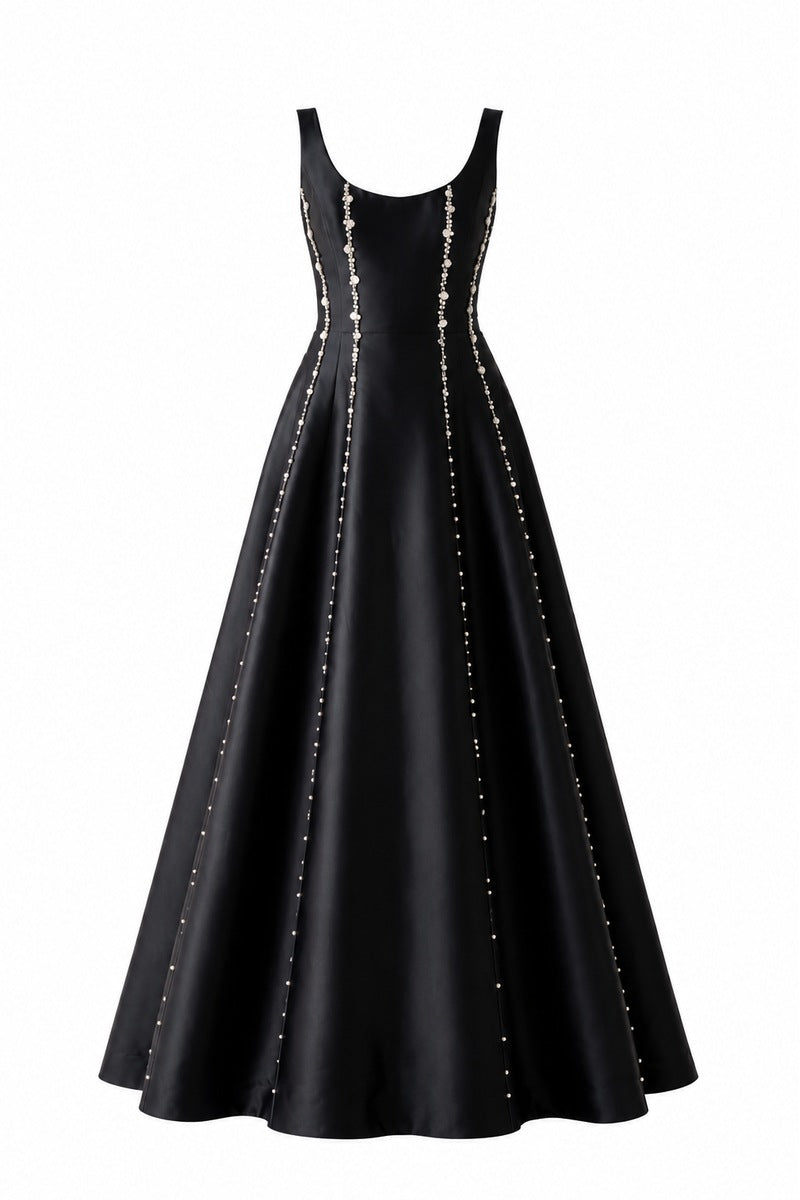 Black Seraphine gown by Nihan Peker, elegant long dress with flowing fabric and subtle detailing, suitable for formal occasions.