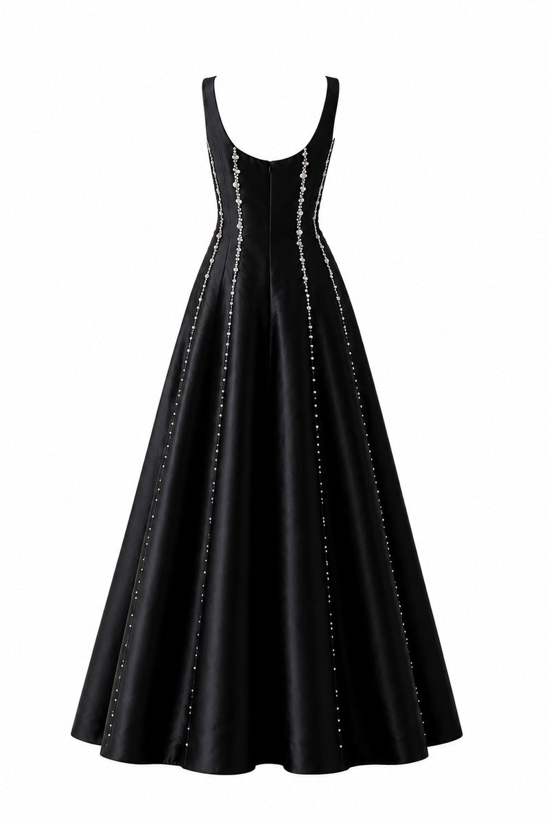 Black Seraphine gown by Nihan Peker featuring elegant fabric and a flowing silhouette, perfect for formal occasions.