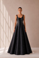 Black Seraphine gown by Nihan Peker featuring elegant fabric and a flowing silhouette, perfect for formal occasions.