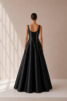 Black Seraphine gown by Nihan Peker with elegant flowing fabric and detailed design, perfect for formal occasions.