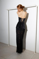 Black Seren corset and lace co-ord set by Rayane Bacha featuring intricate lace details and a fitted silhouette.