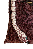Close-up of SAC DE SOUL Serpent Big Burgundy and Cream shoulder bag showing textured snake pattern and elegant design.