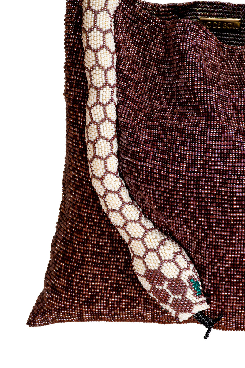 Close-up of SAC DE SOUL Serpent Big Burgundy and Cream shoulder bag showing textured snake pattern and elegant design.