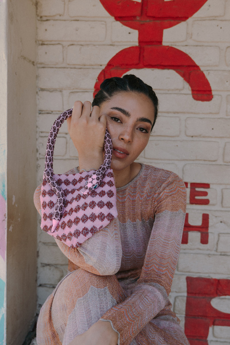 Pink Serpent Mini shoulder bag by SAC DE SOUL with a sleek, compact design and stylish snake-inspired pattern.