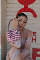 Pink Serpent Mini shoulder bag by SAC DE SOUL, featuring a textured snake pattern and compact design.