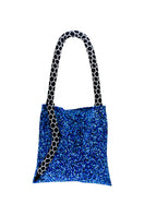 Small blue and black snake-patterned shoulder bag by SAC DE SOUL with adjustable strap and sleek design.