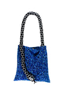 Small blue and black serpent shoulder bag by SAC DE SOUL with a sleek design and compact size.
