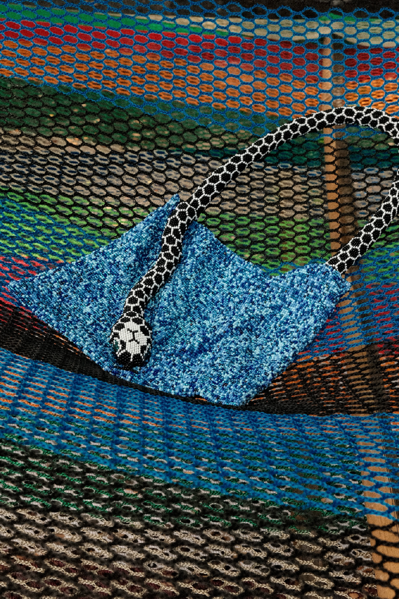 Blue and black Serpent small shoulder bag by SAC DE SOUL, featuring a stylish snake pattern and compact design.