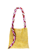 Small gold and pink serpent shoulder bag by SAC DE SOUL with white accents, stylish and compact for everyday use.