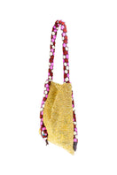 Serpent small gold shoulder bag by SAC DE SOUL with pink and white accents, featuring a sleek, stylish design.