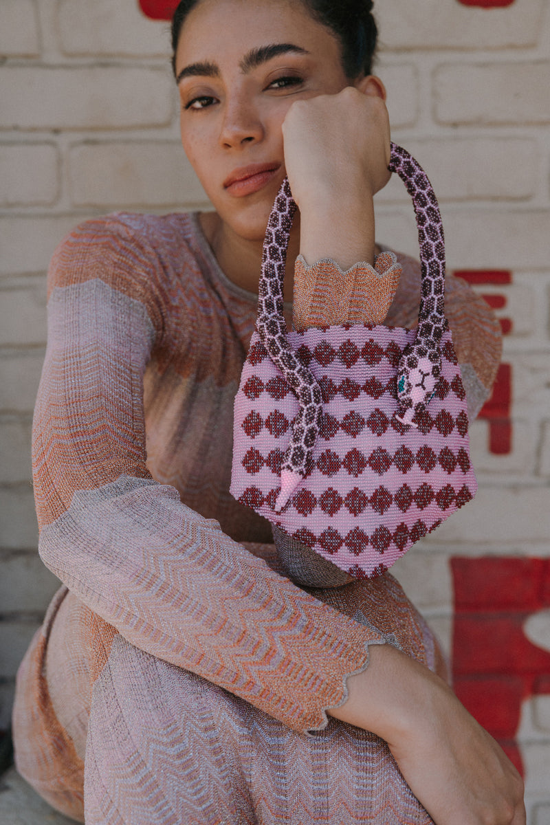 Pink Serpent Mini shoulder bag by SAC DE SOUL, featuring a textured snake print and compact design.