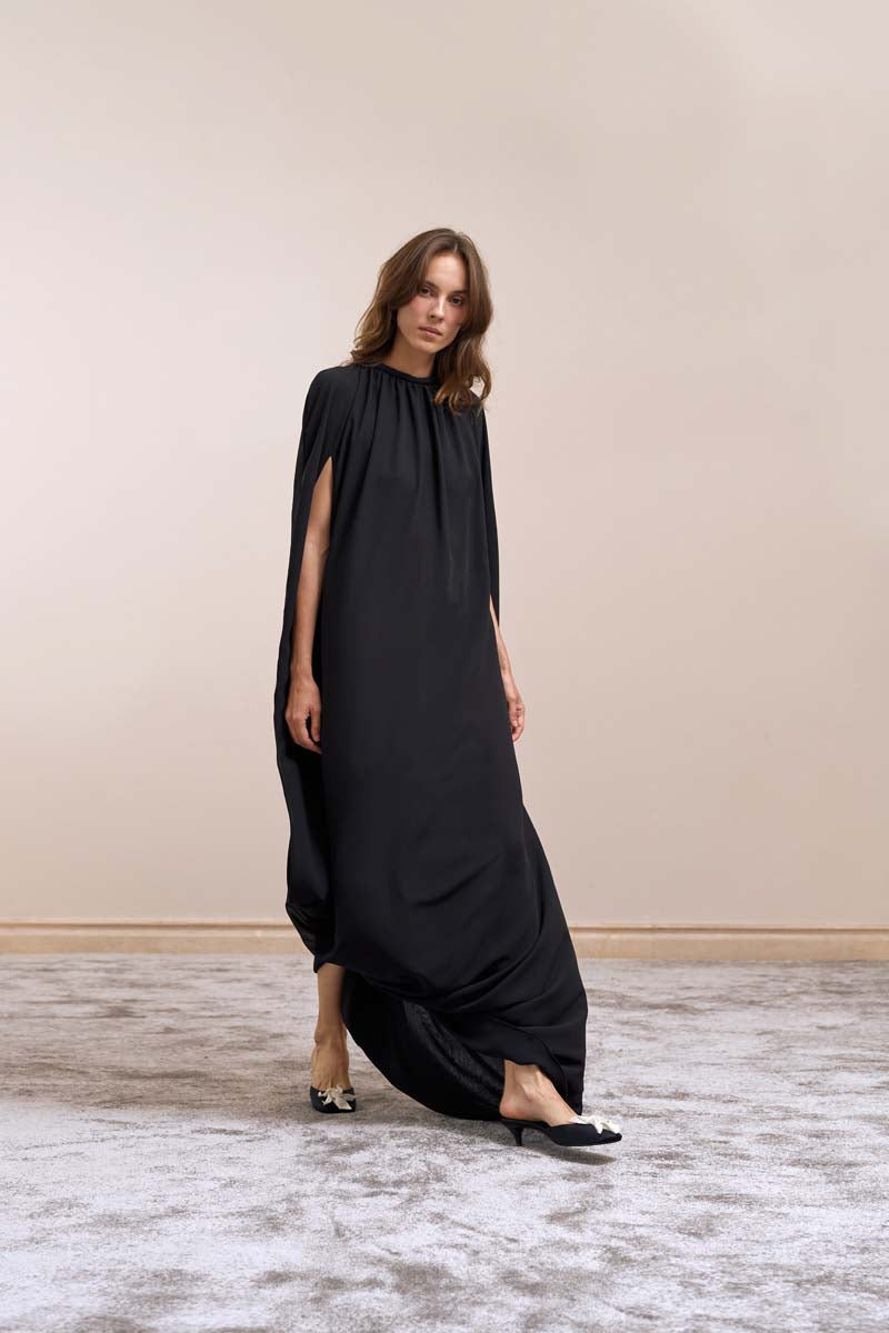 Black sheer midi dress from YASSMIN SALEH featuring a fitted silhouette and elegant design, front view.