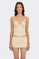 Beige shell bustier top by Stolen Stores featuring a fitted design and shell-inspired detailing on a neutral background.