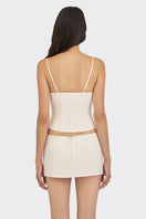 Off-white shell hand-embroidered bustier top with intricate embroidery, stylish and fitted from Stolen Stores.