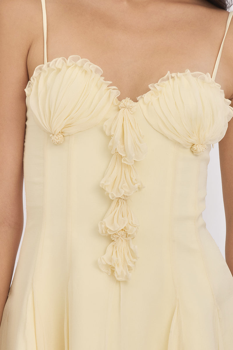 Light yellow shell mini dress by Stolen Stores, featuring a fitted corset style and stylish design, perfect for warm weather.