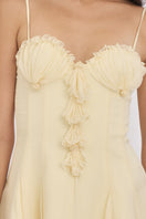 Light yellow shell mini dress by Stolen Stores, featuring a fitted silhouette and stylish design perfect for casual or dressy occasions.