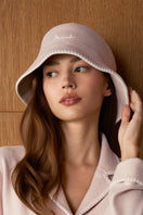 Pink Shell women's silk wool bucket hat by MANITO, shown with a soft, textured fabric and a classic wide-brim design.