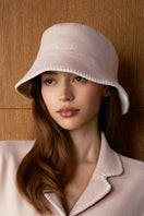 Pink Shell women's silk wool bucket hat by MANITO, shown with a soft, stylish brim and cozy fabric texture.