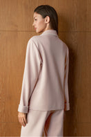 Pink silk and wool women's pajama set by MANITO featuring a comfortable, stylish design perfect for relaxing at home.