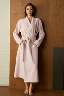 Pink Shell women's silk wool robe by MANITO, soft and luxurious fabric, shown draped elegantly on a model.