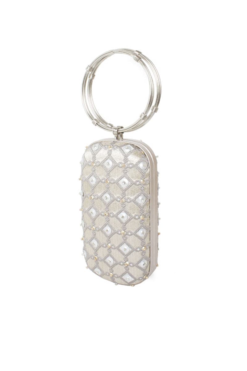 Silver printed embellished menotte clutch bag by Sarah's Bag, featuring a shield design and intricate detailing.