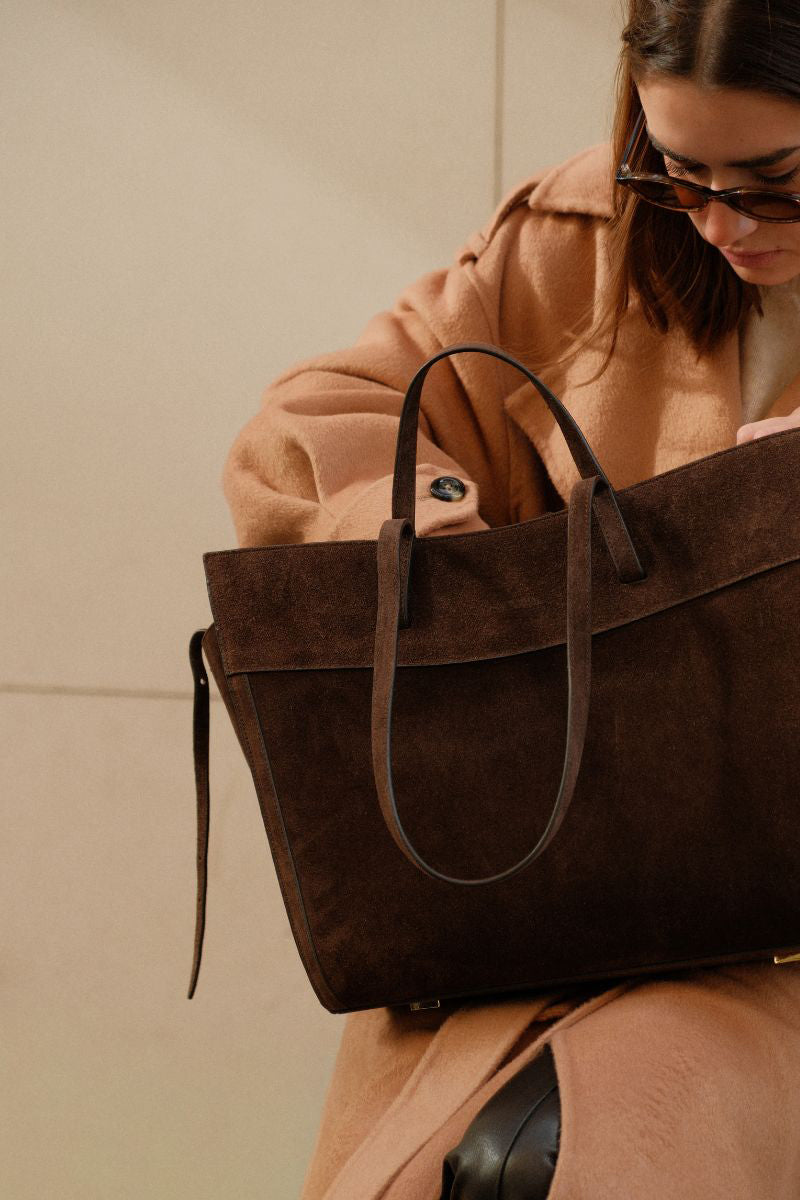 Saonara chocolate suede shoulder shopping bag with a sleek design and sturdy straps, perfect for everyday use.