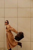 Saonara chocolate suede shoulder shopping bag with sleek design and sturdy strap, perfect for everyday use.