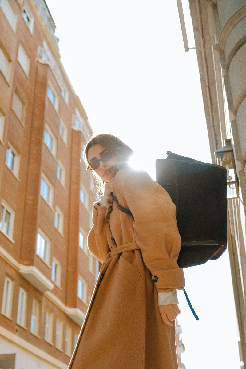 Saonara chocolate suede shoulder shopping bag with sleek design and sturdy handles, perfect for daily use.
