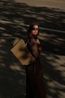 Olive suede shoulder bag by Saonara featuring a sleek design and top handle, perfect for everyday use.