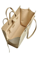 Taupe leather shoulder shopping bag by Saonara with sleek design and sturdy handles, perfect for everyday use.